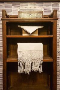 a wooden book shelf with a white object on it at Torino Mon Amour in Turin