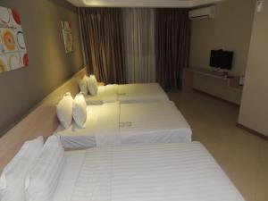 Postel nebo postele na pokoji v ubytování Dela Chambre Hotel