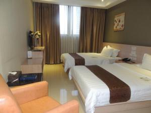 Postel nebo postele na pokoji v ubytování Dela Chambre Hotel