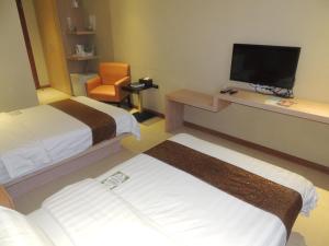 Postel nebo postele na pokoji v ubytování Dela Chambre Hotel