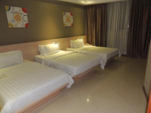 Postel nebo postele na pokoji v ubytování Dela Chambre Hotel