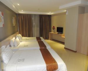 Postel nebo postele na pokoji v ubytování Dela Chambre Hotel