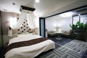Katil atau katil-katil dalam bilik di Hotel Rose (Adult Only)