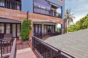 a house with a deck and a roof at V Condominium Samui in Bophut