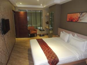 Postel nebo postele na pokoji v ubytování Dela Chambre Hotel