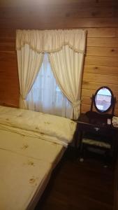 Ένα ή περισσότερα κρεβάτια σε δωμάτιο στο Xin Cai Homestay