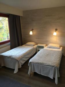 Postel nebo postele na pokoji v ubytování Guesthouse Borealis