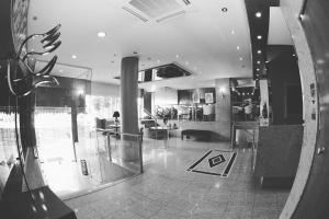a view of a kitchen and a living room at Hotel Galaxias in Agrinio