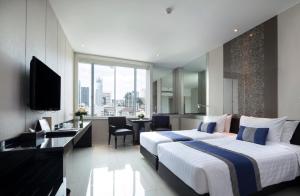 Katil atau katil-katil dalam bilik di Mandarin Hotel Managed by Centre Point