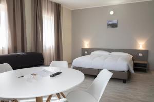 Posteľ alebo postele v izbe v ubytovaní Hotel & Wellness Stella Delle Langhe