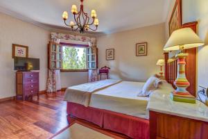 Llit o llits en una habitació de Hotel Spa Villalba