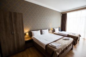 Katil atau katil-katil dalam bilik di Hotel Almi