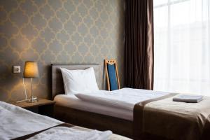Katil atau katil-katil dalam bilik di Hotel Almi