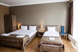 Katil atau katil-katil dalam bilik di Hotel Almi