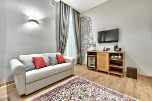 TV a/nebo společenská místnost v ubytování Palazzo Consiglia - IK Collection