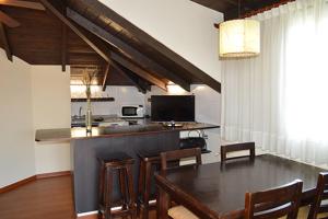 a kitchen and dining room with a table and chairs at Carilo Quimey in Carilo