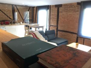 a living room with a couch and a table at Suites La Catedral in León