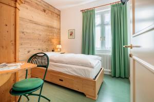 Łóżko lub łóżka w pokoju w obiekcie Hotel Oasi