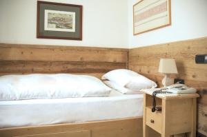 Łóżko lub łóżka w pokoju w obiekcie Hotel Oasi