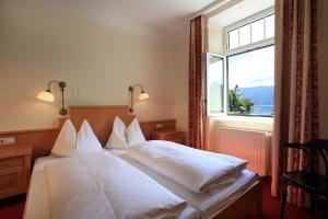 Posteľ alebo postele v izbe v ubytovaní Romantik Residenz (Ferienwohnungen Hotel Im Weissen Rössl) - Dependance