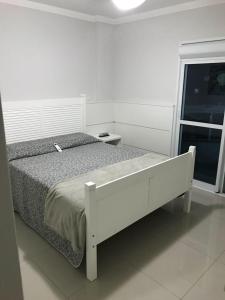 Cama o camas de una habitación en Edifício Dalpiaz