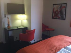 سرير أو أسرّة في غرفة في Hotel Harmonien