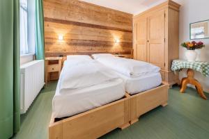 Łóżko lub łóżka w pokoju w obiekcie Hotel Oasi