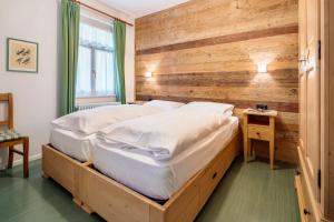 Łóżko lub łóżka w pokoju w obiekcie Hotel Oasi