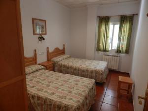 Postel nebo postele na pokoji v ubytování Apartamentos Martin