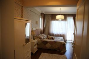 Ein Bett oder Betten in einem Zimmer der Unterkunft Damla Pansiyon