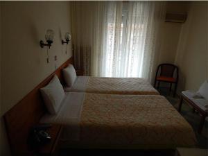 Postel nebo postele na pokoji v ubytování Lito Hotel