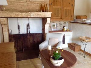 a living room with a couch and a table at Domaine Charente - Holiday Home with own garden in Mazières