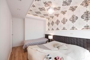 Giường trong phòng chung tại Elegance Sopot Gdynia Apartment