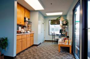a kitchen with a table and a dining room at Americas Best Value Inn - Rome in Lindale