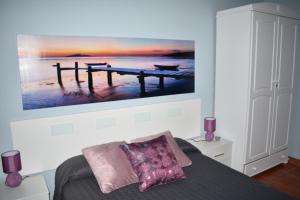 Łóżko lub łóżka w pokoju w obiekcie Apartamentos Flor del Cotillo