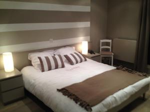 Voodi või voodid majutusasutuse Hotel Val De La Cascade toas