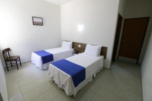 Postel nebo postele na pokoji v ubytování Hotel Porto do Sol