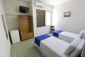 Postel nebo postele na pokoji v ubytování Hotel Porto do Sol