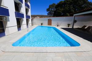Bazén v ubytování Hotel Porto do Sol nebo v jeho okolí