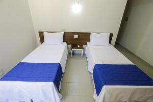 Postel nebo postele na pokoji v ubytování Hotel Porto do Sol