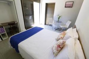 Postel nebo postele na pokoji v ubytování Hotel Porto do Sol