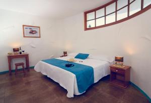 A bed or beds in a room at Galapagos Native