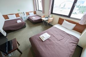 Postel nebo postele na pokoji v ubytování Select Inn Tsuruga + 19 fotografií