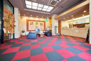 a lobby with a checkered floor in a store at Select Inn Tsuruga in Tsuruga