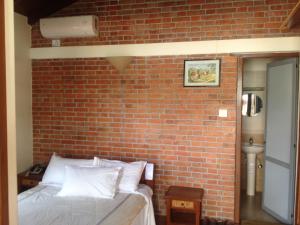 Uma cama ou camas num quarto em Vardan Resort n' Apartment