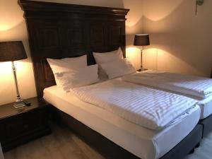 Postel nebo postele na pokoji v ubytování Höhen Hotel Viersen