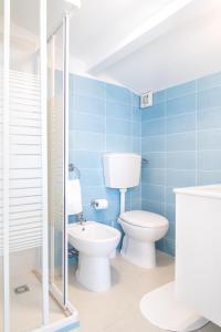 a bathroom with a toilet and a sink at Casa Vacanze Albora in Punta Secca