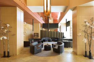 a lobby with couches and tables in a building at Hotel SB Diagonal Zero 4 Sup in Barcelona