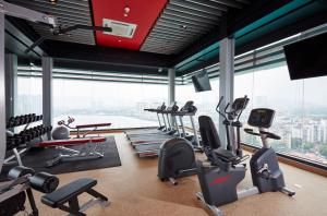 a gym with treadmills and exercise equipment in a building at Sunway Velocity Hotel Kuala Lumpur in Kuala Lumpur