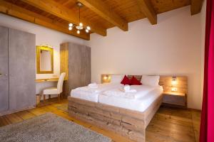 En eller flere senge i et værelse på Villa Marienhof